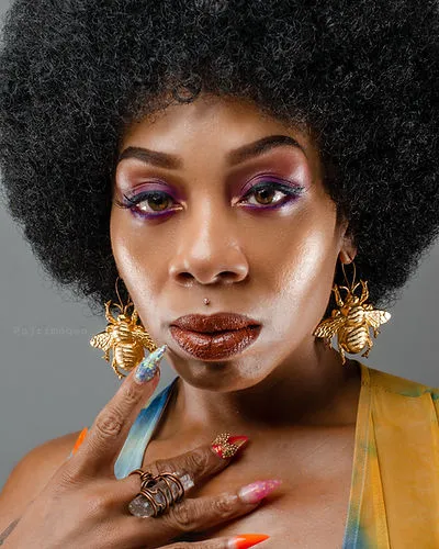 Creative beauty headshot by SJRIMAGES with bold makeup and natural hair